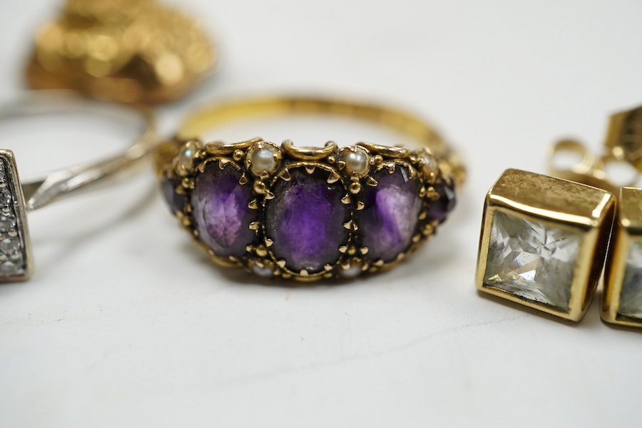 An 18ct and nine stone simulated diamond set cluster ring, a modern 18ct gold and diamond set square cluster ring, a Victorian 15ct gold, amethyst and seed pearl set half hoop ring, two pairs of 9ct and gem set ear studs